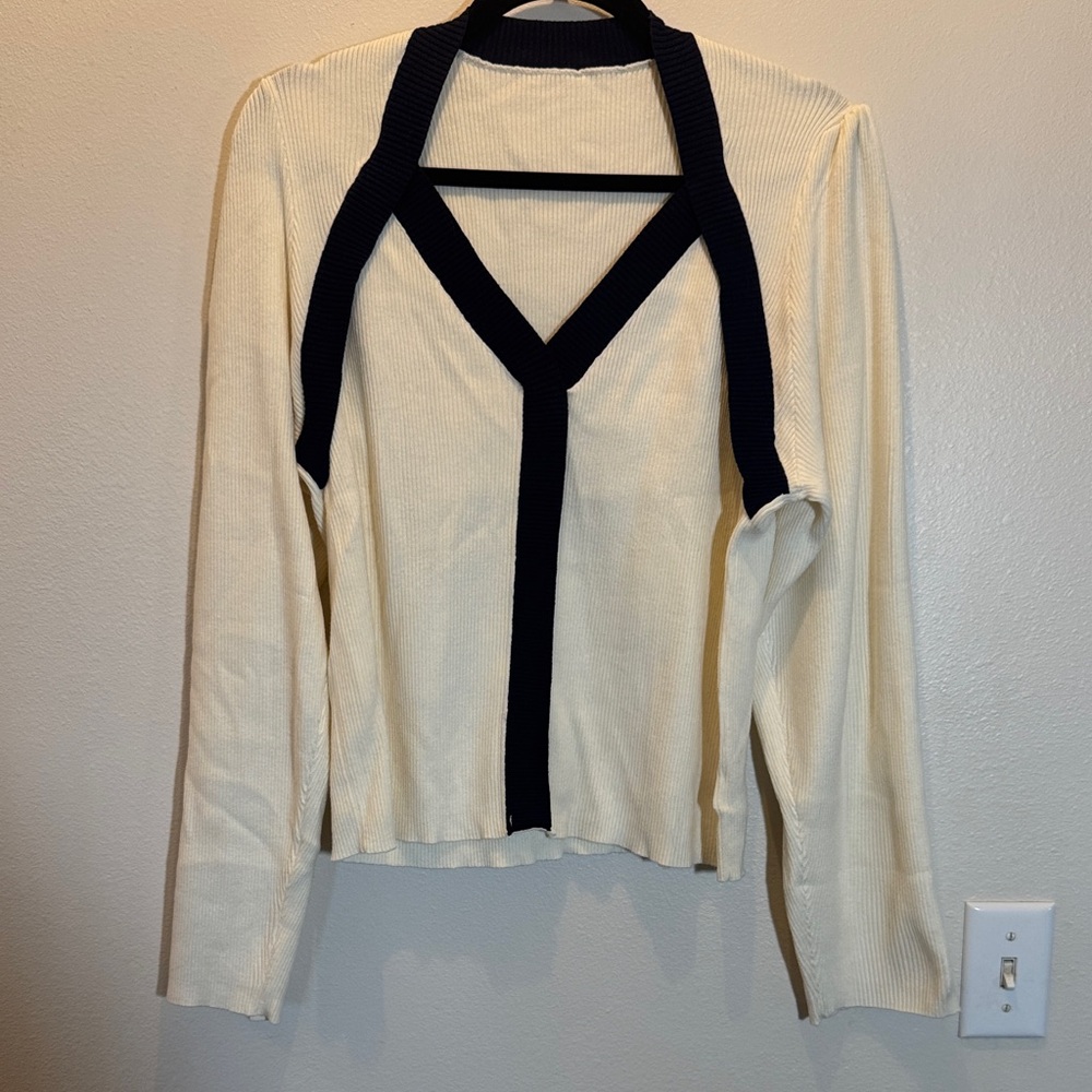 Knit v neck sweater with contrasting black binding